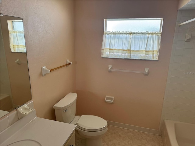 bathroom with baseboards, shower / bathing tub combination, vanity, and toilet