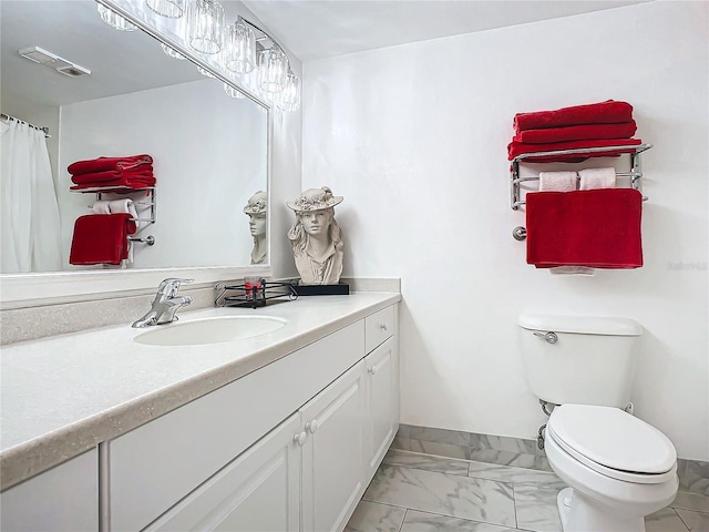 bathroom with vanity and toilet