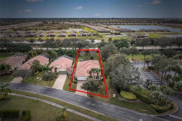 birds eye view of property with a water view