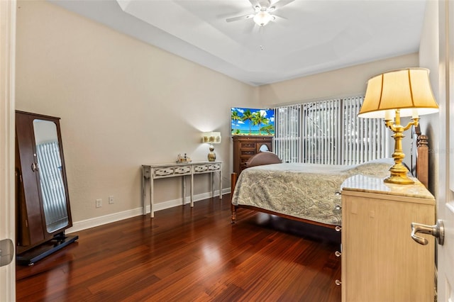 bedroom featuring dark hardwood / wood-style floors and ceiling fan