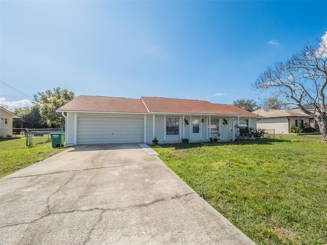 ranch-style house with a garage, a porch, and a front yard