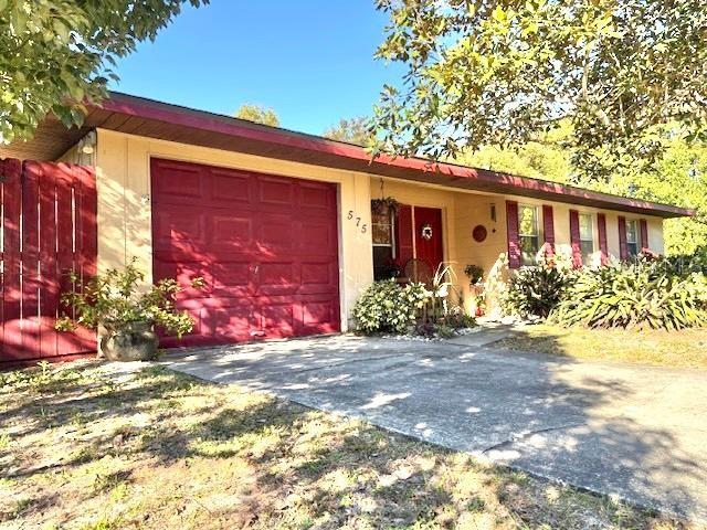 single story home with a garage