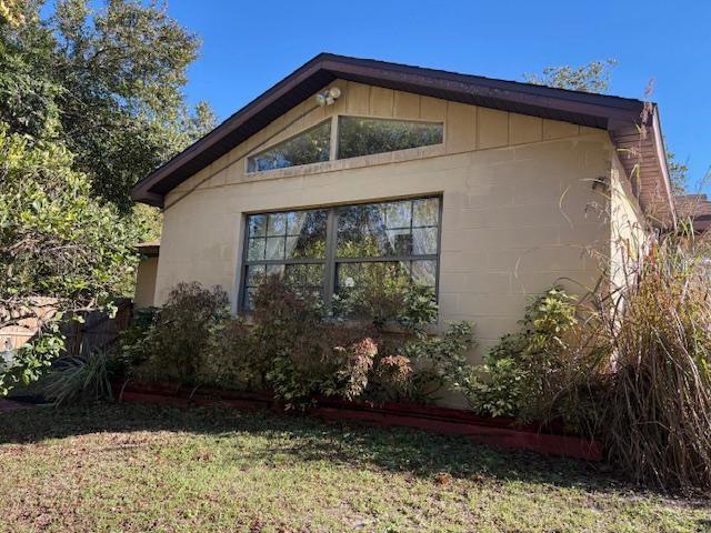 view of property exterior featuring a yard