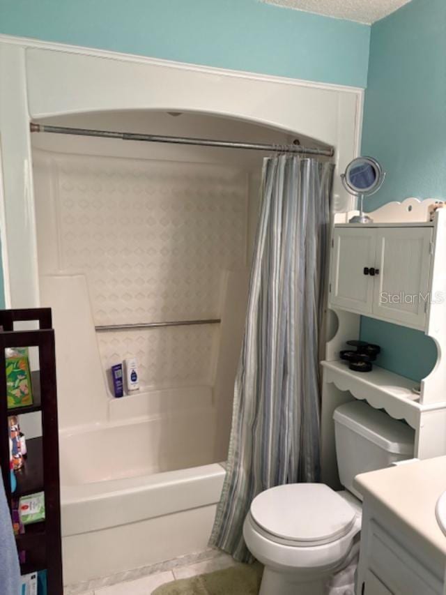 full bathroom with vanity, toilet, a textured ceiling, and shower / bath combo with shower curtain