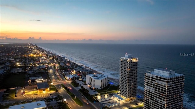 aerial view at dusk with a water view