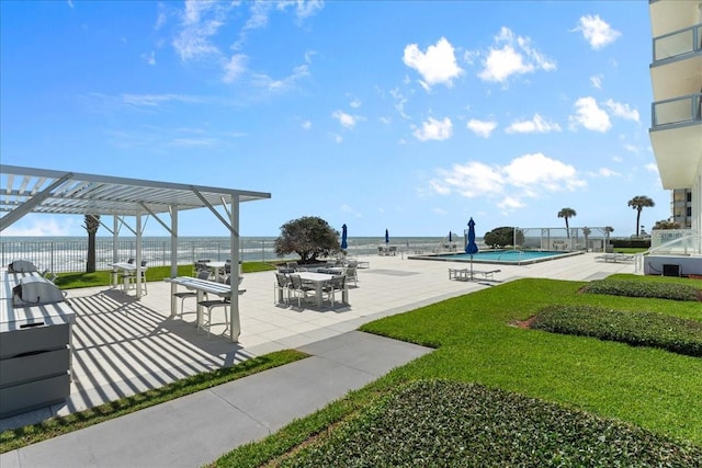 surrounding community featuring a pool, a pergola, a patio area, and a water view