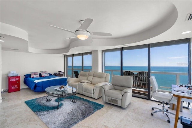 bedroom featuring a water view and ceiling fan