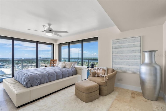 bedroom with ceiling fan and access to exterior