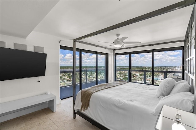 bedroom with access to outside, expansive windows, and ceiling fan