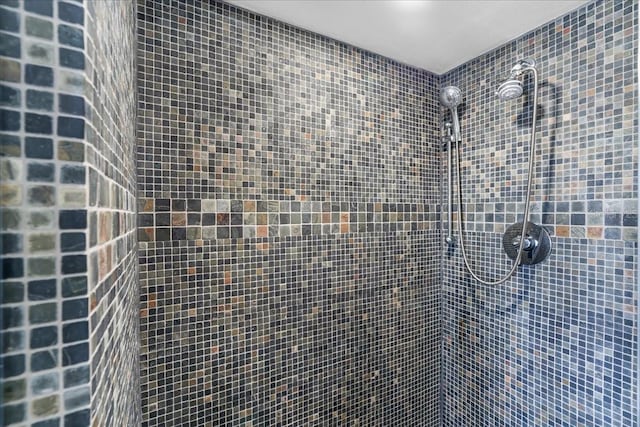 bathroom with a tile shower