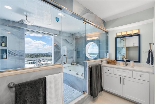 bathroom featuring tile patterned floors, vanity, and independent shower and bath