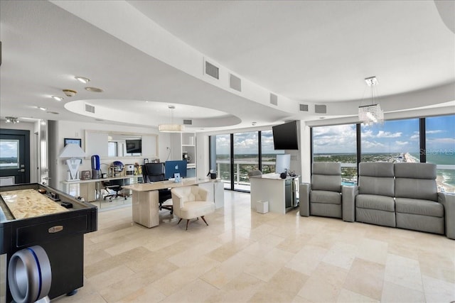 living room featuring a tray ceiling