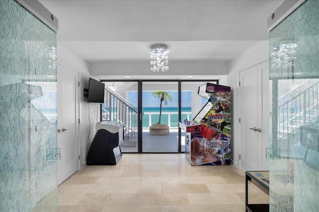 hallway with a chandelier