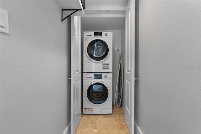 laundry room featuring stacked washing maching and dryer