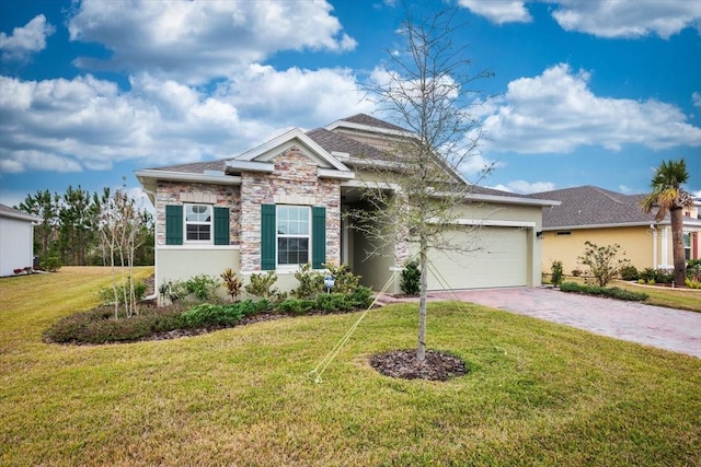 view of front of house featuring a front yard and a garage