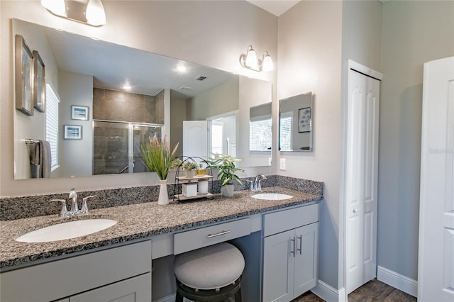 bathroom with vanity and an enclosed shower