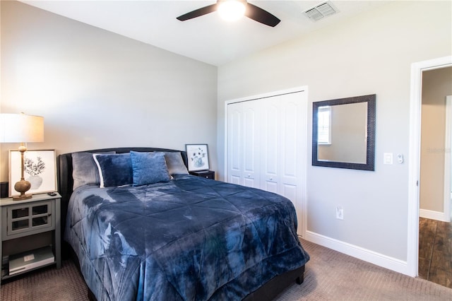 carpeted bedroom with a closet, ceiling fan, and lofted ceiling