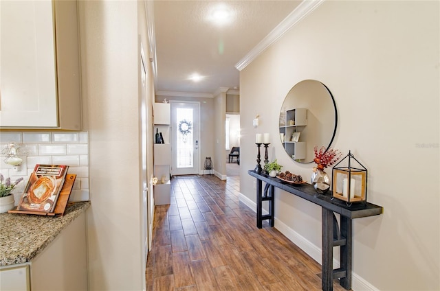 doorway to outside featuring dark wood-type flooring and crown molding