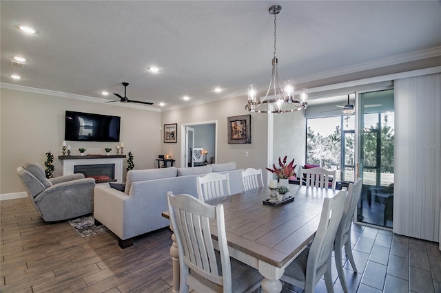 dining space featuring ceiling fan, ornamental molding, and dark hardwood / wood-style floors