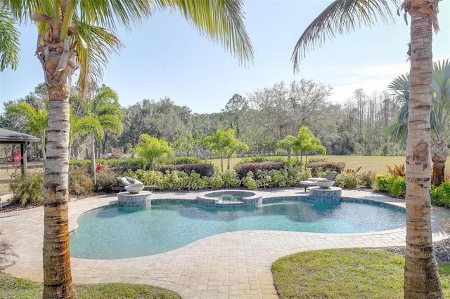 view of swimming pool with a pool with connected hot tub