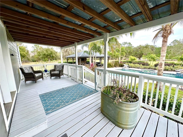 deck featuring an outdoor living space and an outdoor pool