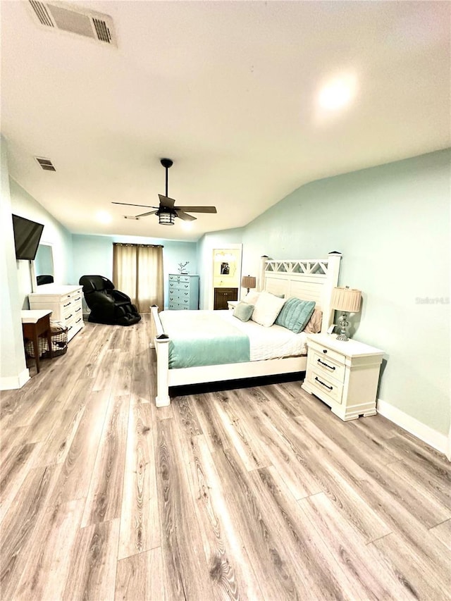 bedroom featuring visible vents, ceiling fan, and wood finished floors