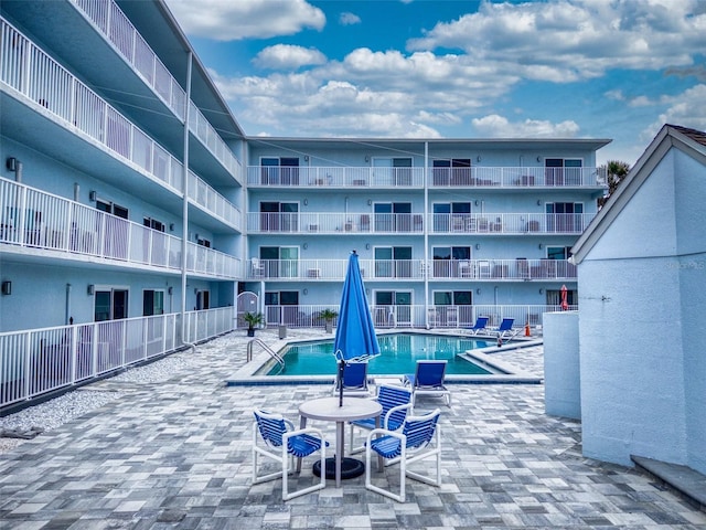 view of swimming pool featuring a patio area