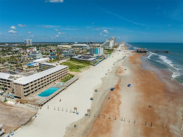 drone / aerial view featuring a view of the beach and a water view