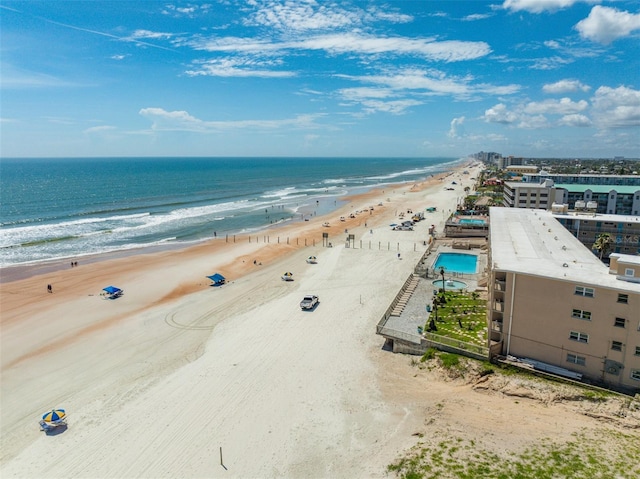 aerial view with a water view and a view of the beach