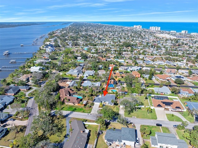 birds eye view of property with a water view