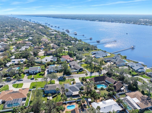 birds eye view of property featuring a water view