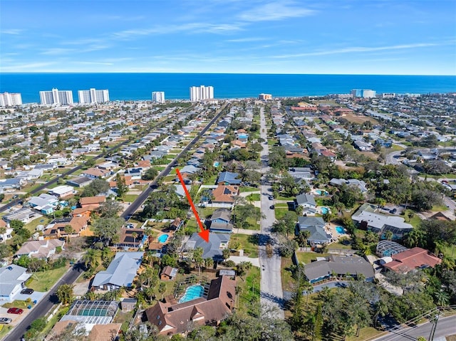 drone / aerial view with a water view