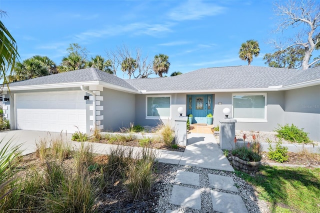 ranch-style house featuring a garage