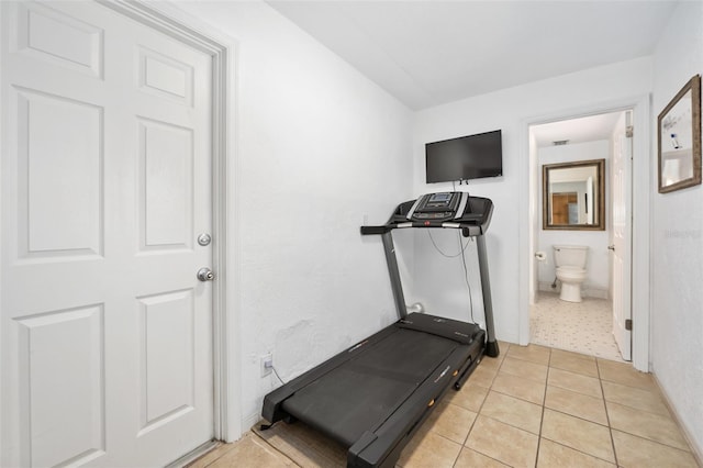 exercise area with light tile patterned flooring