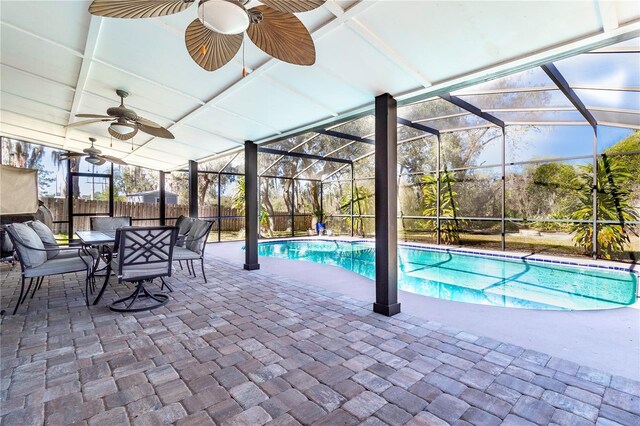 view of swimming pool with a lanai, a patio, and ceiling fan