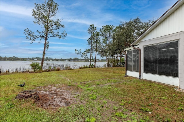 view of yard with a water view