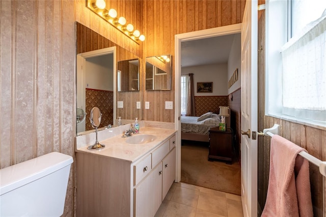 bathroom with wallpapered walls, toilet, vanity, ensuite bath, and tile patterned floors