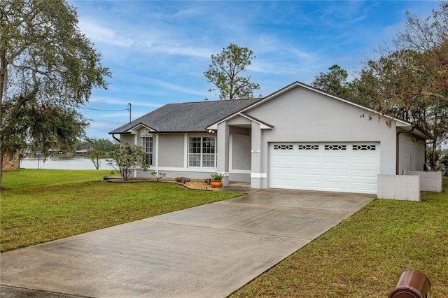 ranch-style home featuring stucco siding, a shingled roof, a garage, driveway, and a front lawn