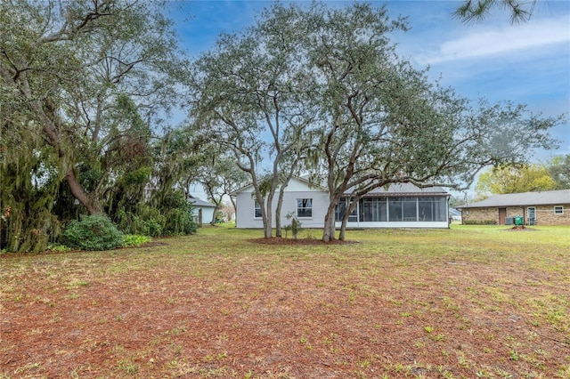 view of yard with a sunroom
