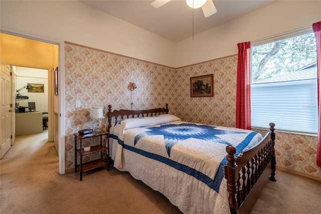 bedroom with wallpapered walls, multiple windows, baseboards, and light colored carpet