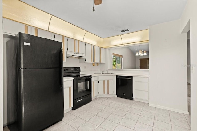 kitchen with black appliances, under cabinet range hood, a sink, light countertops, and light tile patterned floors