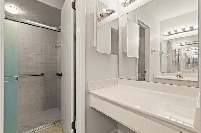 full bathroom with a stall shower and vanity