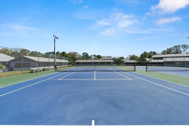 view of sport court with community basketball court and fence