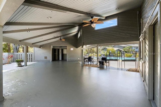 view of patio featuring a pool and a ceiling fan