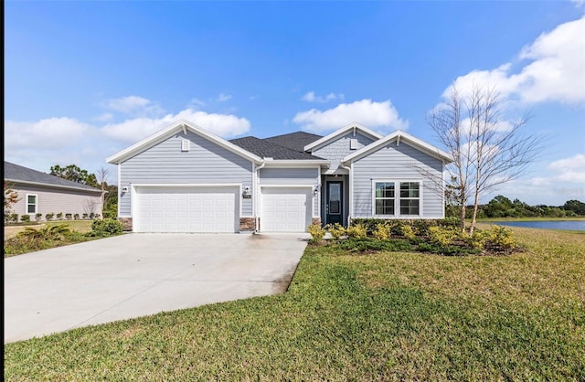 view of front of home featuring a garage and a front yard