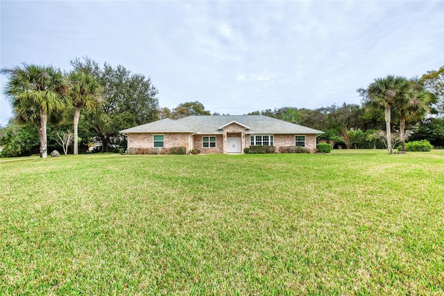 single story home featuring a front yard