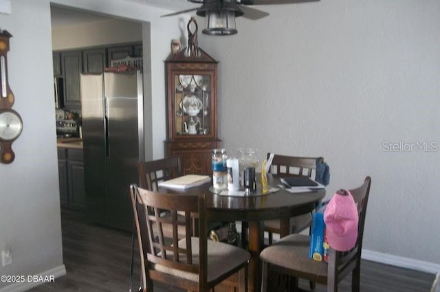 dining area with dark hardwood / wood-style floors and ceiling fan