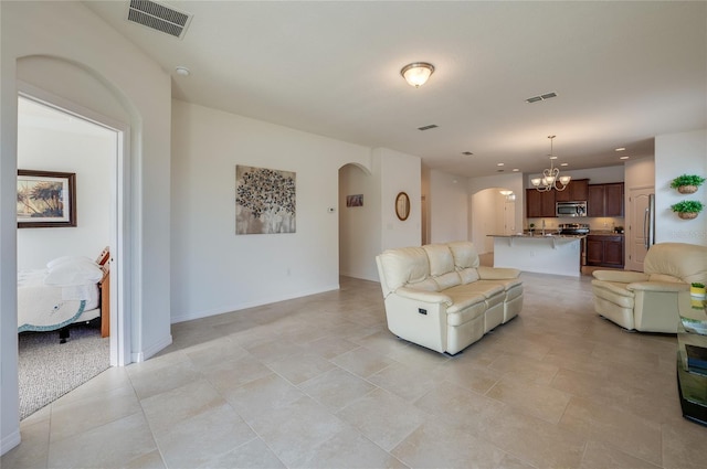 living room with an inviting chandelier