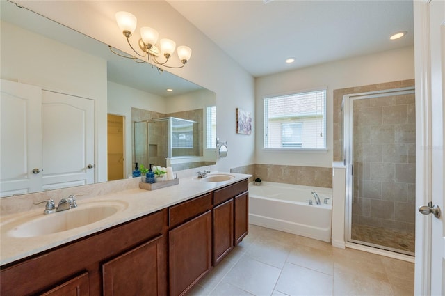 bathroom with tile patterned flooring, vanity, and independent shower and bath