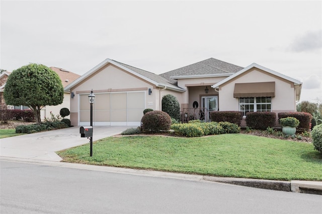 single story home with a garage and a front lawn